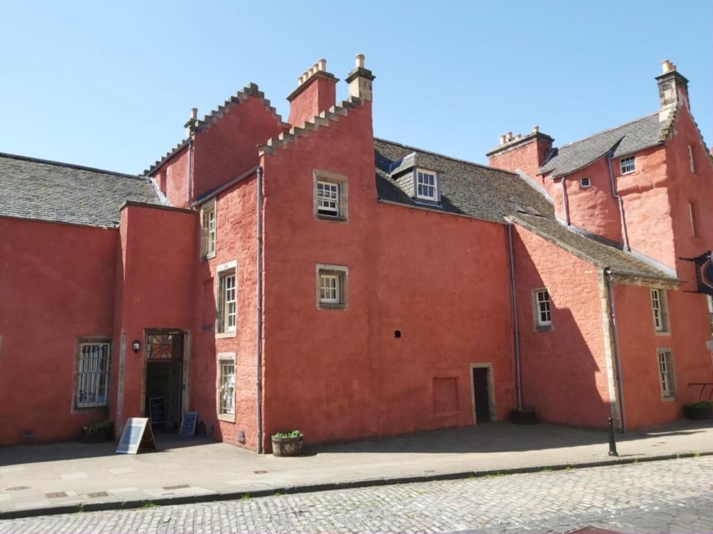 Abbot House, the pink harled house on Maygate in Dunfermline